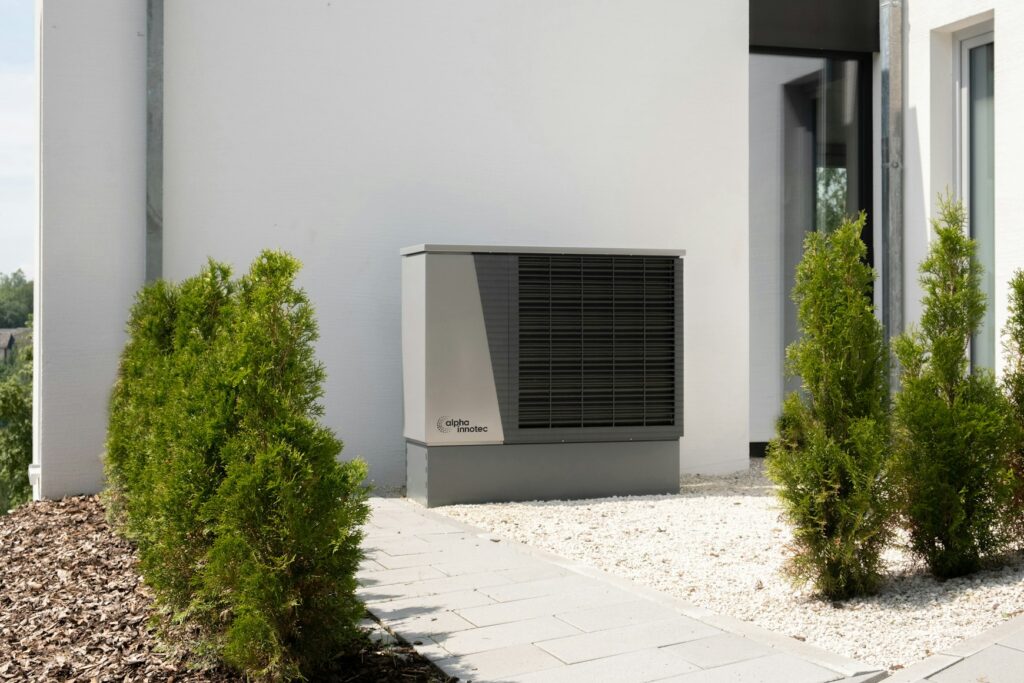 Modern outdoor heat pump beside a house