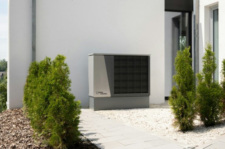 Modern outdoor heat pump beside a house