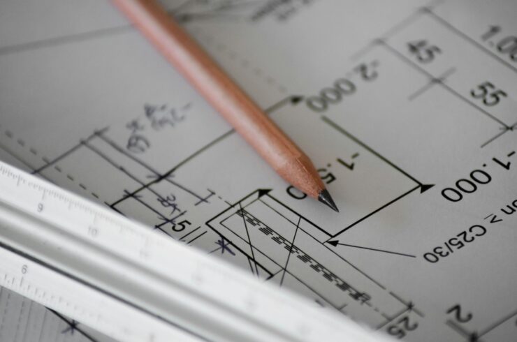 Pencil resting on architectural plans