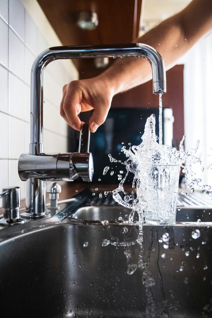 Person opening a faucet