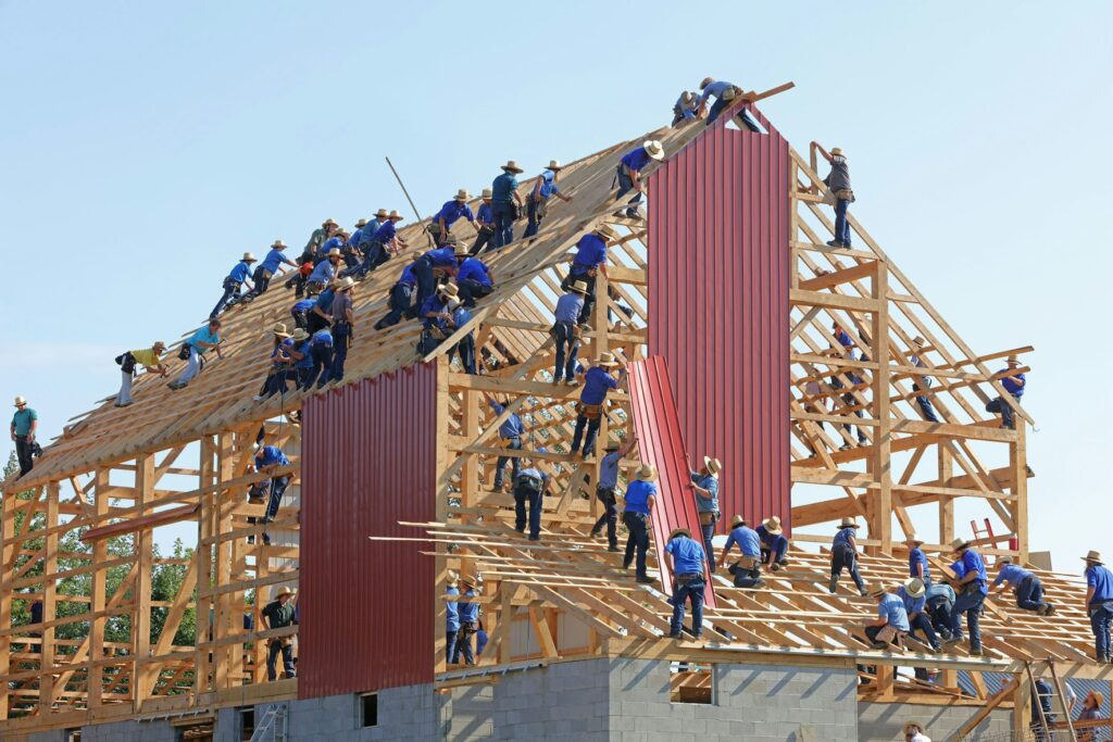 Workers constructing a timber frame