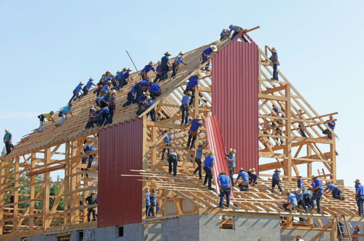 Workers constructing a timber frame