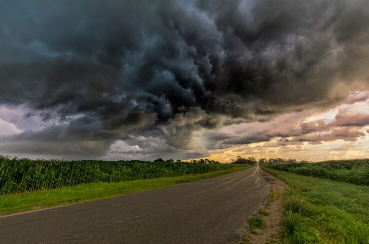 Dark storm clouds over a green field