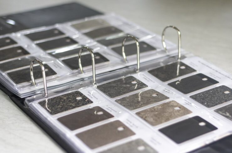 Open binder displaying countertop material samples